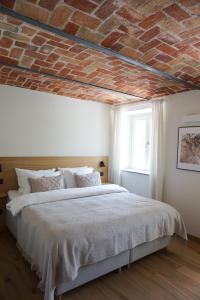 En eller flere senge i et værelse på Cascina Canelli