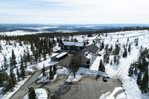 an aerial view of a building in the snow at Auroras by Kaltios, Gielas, Ski-in Ski-out, Mountain view in Kittilä