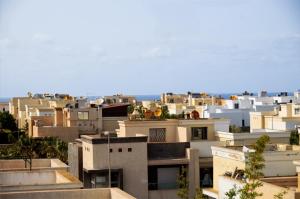 a view of a city with white buildings at Villa 130 Spacieuse 4 chambres dar bouazza proche plage in Casablanca