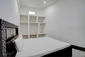 Voodi või voodid majutusasutuse Hotel O Highway Plaza And Resorts 2 toas