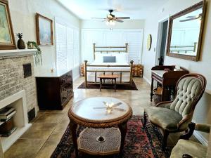 a living room with a bed and a coffee table at Craftsman by Downtown Uvalde in Uvalde