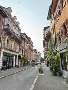an empty street in a city with buildings at L'échappée belle in Thonon-les-Bains
