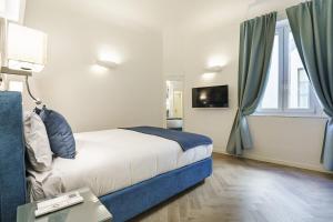 a hotel room with a bed and a window at Designer Apartment in Oltrarno in Florence