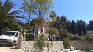 a white truck parked in front of a house at Resort Village T.N. Milna in Vis