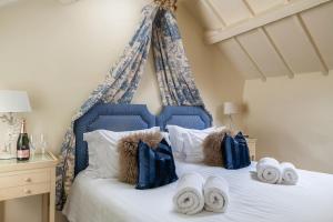 Postel nebo postele na pokoji v ubytování Storehouse Cottage