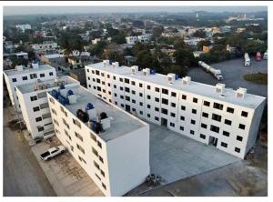a white building with a view of a city at Blue Beach 2 min to Miramar Beach in Ciudad Madero
