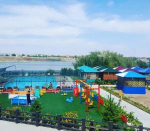 a playground with a water park with a pool at Boat Station in Kapchagay