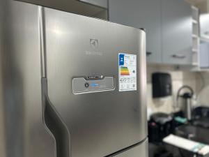 a stainless steel refrigerator in a kitchen at Apartamento no Costa e silva in Joinville