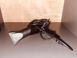 a black gun is sitting on a table at Garden villa two-bedroom suite in Vari