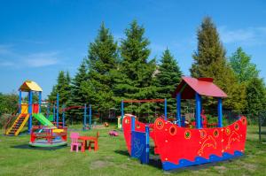 a playground with colorful play equipment in a park at Rafa in Rowy