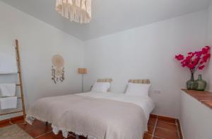 Postel nebo postele na pokoji v ubytování Casa Tragabalas