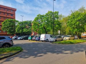 a bunch of cars parked in a parking lot at Nido nel verde in Segrate