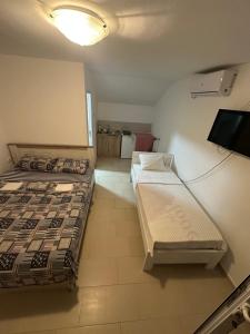 Ένα ή περισσότερα κρεβάτια σε δωμάτιο στο Apartment Bradex Dreams