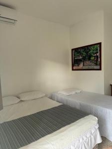 Postel nebo postele na pokoji v ubytování Pousada Central-Ubajara Capital do Turismo