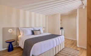 Postel nebo postele na pokoji v ubytování WellClub - Family Wellness & Seaview Suites
