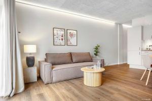 a living room with a couch and a table at Ground-Floor Living with Stylish Nordic Interiors in Aarhus +31 photos
