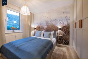 En eller flere senge i et værelse på Green Village "Huus Molen"