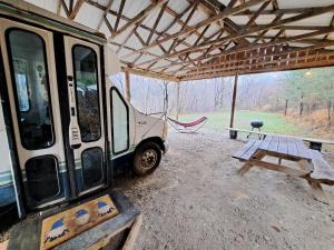Gambar di galeri bagi Covered Bridge Tiny Home Bus On The Water In Rrg di Stanton