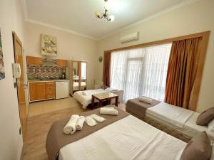 Postel nebo postele na pokoji v ubytování elegance famıly house + 22 fotografií