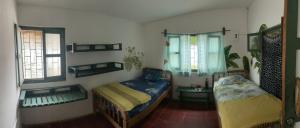 Ένα ή περισσότερα κρεβάτια σε δωμάτιο στο Viento Este Guest House