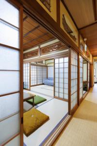 Postel nebo postele na pokoji v ubytování Guesthouse Fukufuku