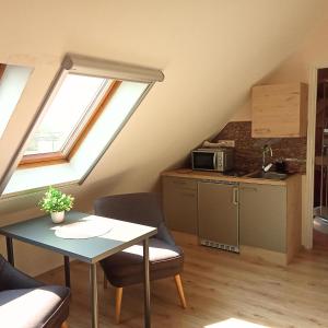 Kuchyňa alebo kuchynka v ubytovaní Orient Apartmanház