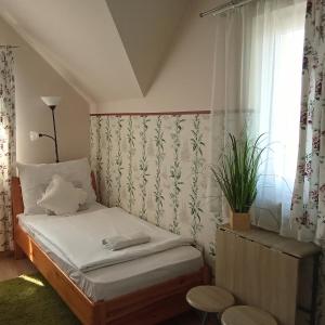 Posteľ alebo postele v izbe v ubytovaní Orient Apartmanház