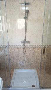 a shower stall with a toilet in a bathroom at Apartmán Marcella, Cumbre del Sol in Cumbre del Sol