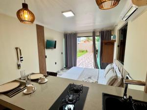 a room with a bed and a view of a room at BayShore Loft in Cabo Frio