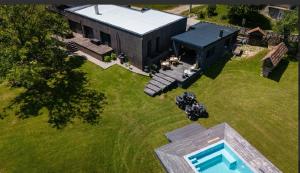 an aerial view of a house with a pool in a yard at Una Meryland Rooms & Bungalow in Kulen Vakuf