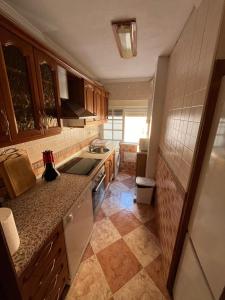 a kitchen with a sink and a counter top at Balneario Cachucha in Puerto Real