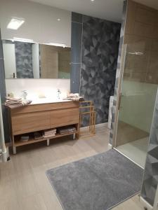 a bathroom with a large tub and a shower at ON SAINT VIT!! magnifique T3 70m2 neuf in Saint-Vit +18 photos
