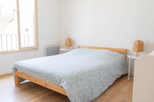 Postel nebo postele na pokoji v ubytování Charmant appartement - 5 mn Zoo de Beauval 4p