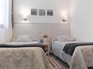 Posteľ alebo postele v izbe v ubytovaní Hostal Dragonflybcn