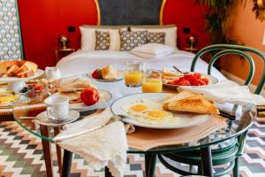 a breakfast table with eggs and toast on a bed at Casa Patrizia Charme B&b in Montenero di Bisaccia
