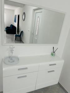 a white dresser with a mirror on top of it at Apartments Angelo in Bibinje +152 photos