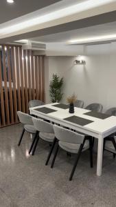 a dining room with a table and chairs at House Sela vrata in Bibinje