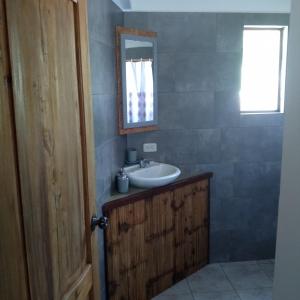 a bathroom with a sink and a mirror at Hotel Transilvania in Jama +13 photos