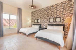 Postel nebo postele na pokoji v ubytování Wonderful 4br villa with maid at Punta Cana Resorts