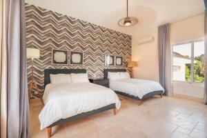 Postel nebo postele na pokoji v ubytování Wonderful 4br villa with maid at Punta Cana Resorts
