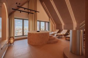 a large room with a round table in a building at Casa Blush - LoftAffair Spa Collection in Gdańsk