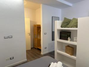 a room with a bunk bed and a hallway at IL CORSO apartment in Cesena