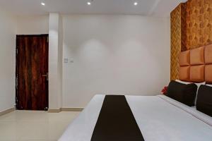 En eller flere senge i et værelse på Hotel O Skycity