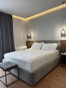 Postel nebo postele na pokoji v ubytování Compas Boutique Hotel