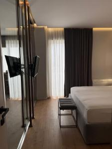 Postel nebo postele na pokoji v ubytování Compas Boutique Hotel