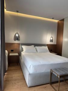 Postel nebo postele na pokoji v ubytování Compas Boutique Hotel