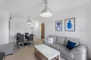 a living room with a couch and a table at AleAnto Playa in El Médano