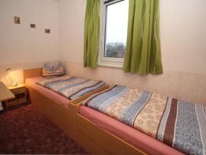 Postel nebo postele na pokoji v ubytování Apartments Spreewaldperle, Alt Zauche