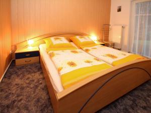 Postel nebo postele na pokoji v ubytování Apartments Spreewaldperle, Alt Zauche