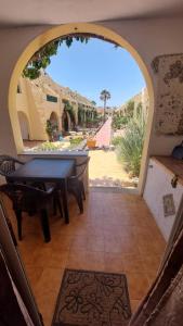 a view of a patio with a table and chairs at Castillo Mar in Caleta De Fuste